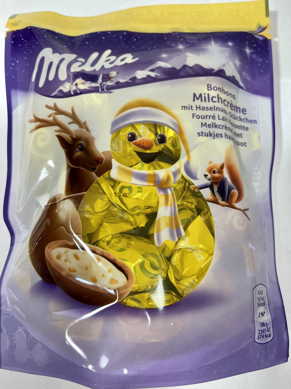 Шоколадні цукерки з кремом і лісовим горіхом Milka Bonbons Milchcreme 86 р Швейцарія