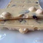 Шоколад білий Millennium з цілим лісовим горіхом і журавлиною 100 г Україна