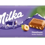 Шоколад молочний із лісовим горіхом Milka Hazelnuts Швейцарія 100 г