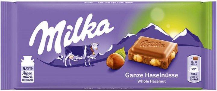 Шоколад молочний з цілим фундуком Milka Ganze Hazelnuts Швейцарія 100 г