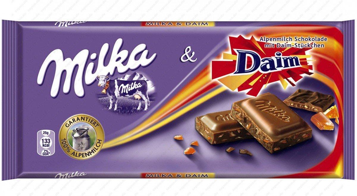 Шоколад молочний з карамеллю і мигдалем Milka Ganze Hazelnuts Швейцарія 100 г