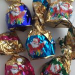 Цукерки Новорічний Мікс із ваніллю, мигдалем, кокосом, апельсином і горіхом із крипсами Baron 1кг Польща