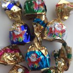 Цукерки Новорічний Мікс із ваніллю, мигдалем, кокосом, апельсином і горіхом із крипсами Baron 1кг Польща